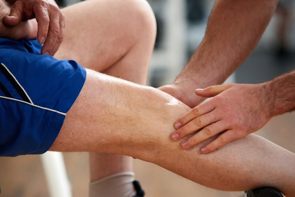 close up man with injured leg hero