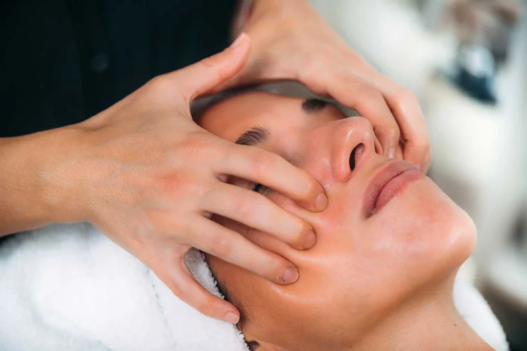 enjoying ayurvedic face massage with essential oil 2024 10 18 10 53 03 utc