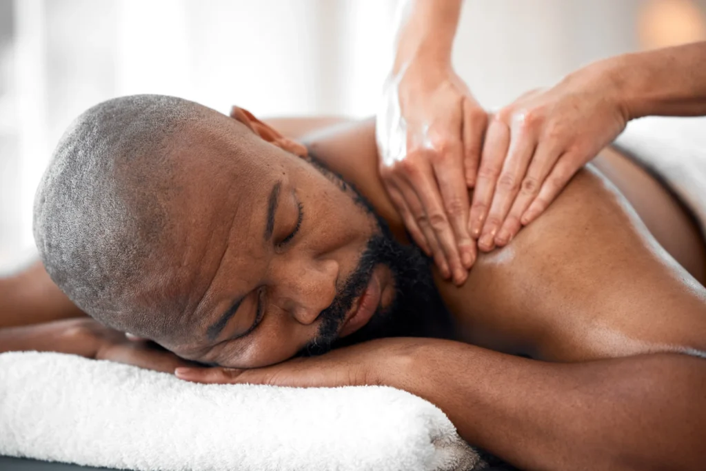 man receiving relaxing massage at indoor